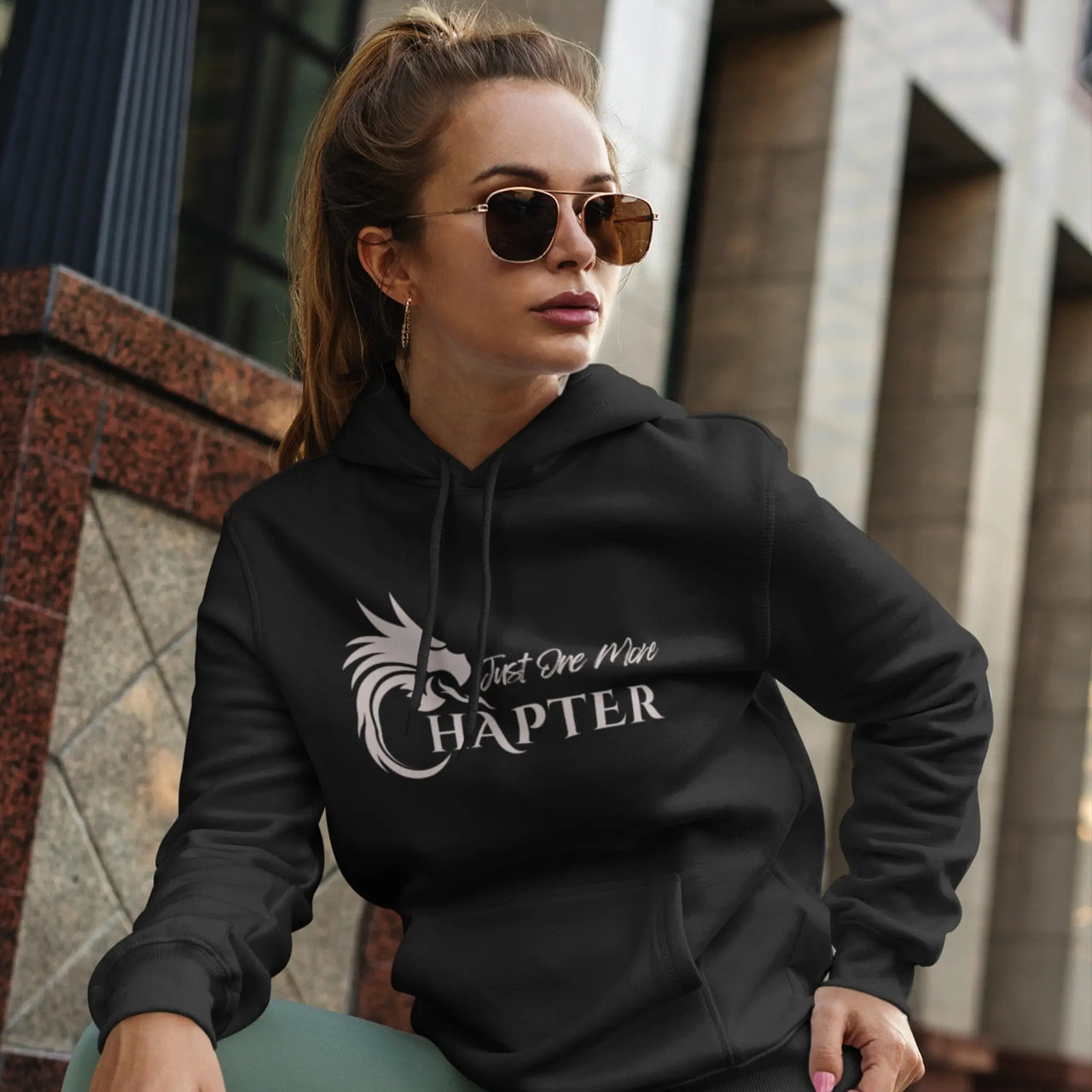 woman in a black Just One More Chapter Hoodie V1