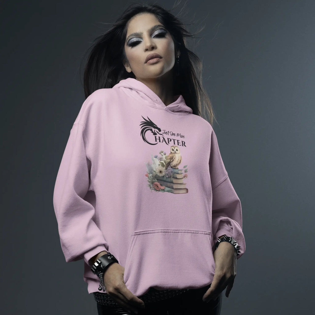 woman wearing a pink Just one more chapter hoodie v2