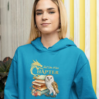 Thumbnail for young woman wearing a Teal Just one more chapter hoodie v3 with gold text