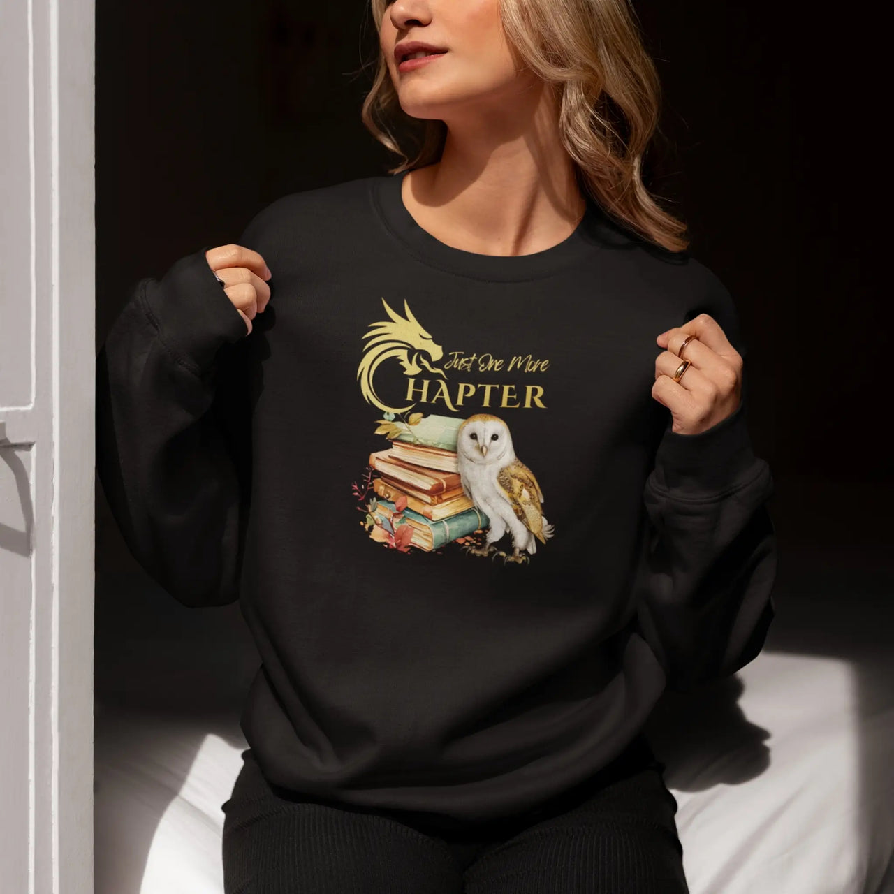 woman wearing the black just one more chapter sweatshirt v2