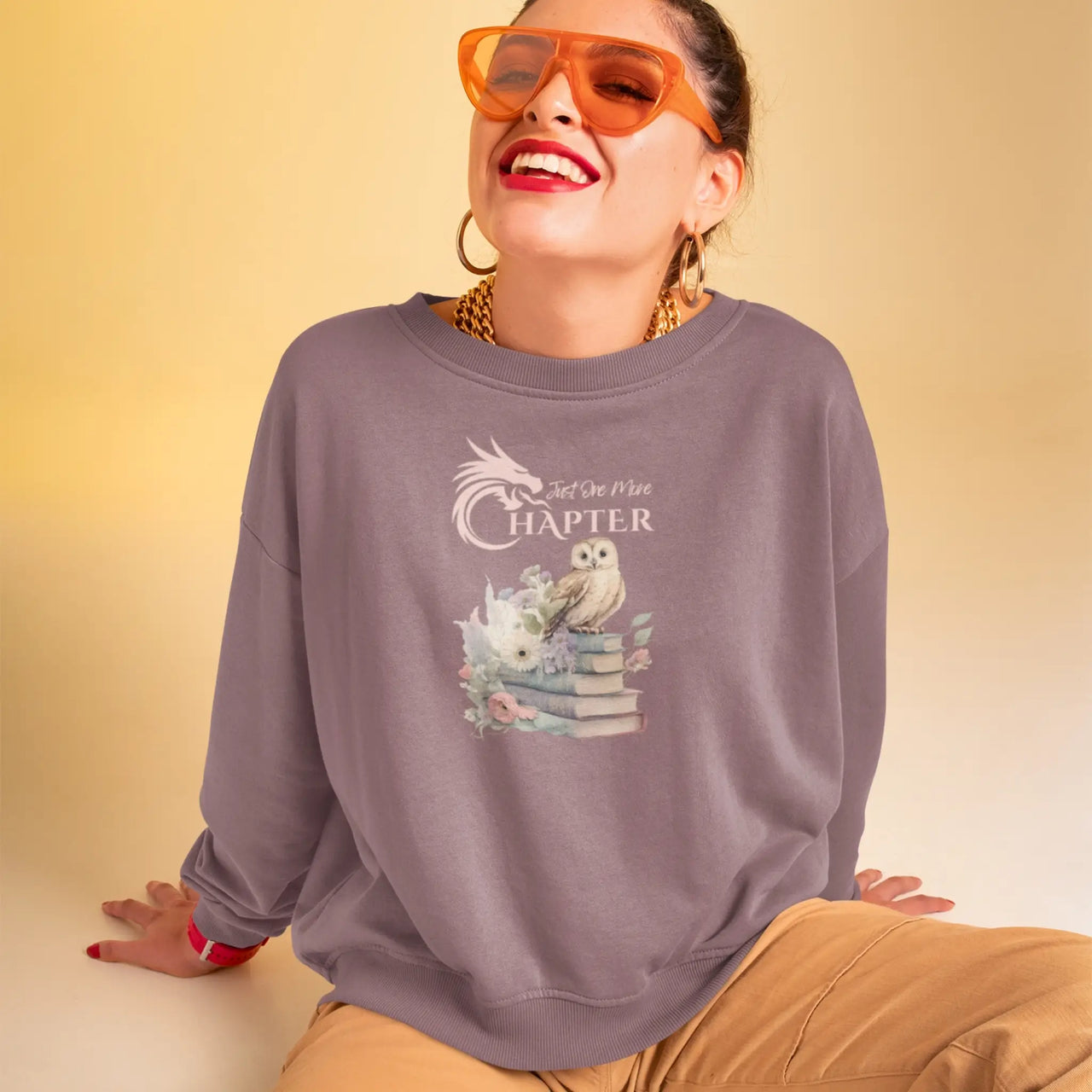 woman wearing a Maroon Just one more chapter sweatshirt v3 with pink text