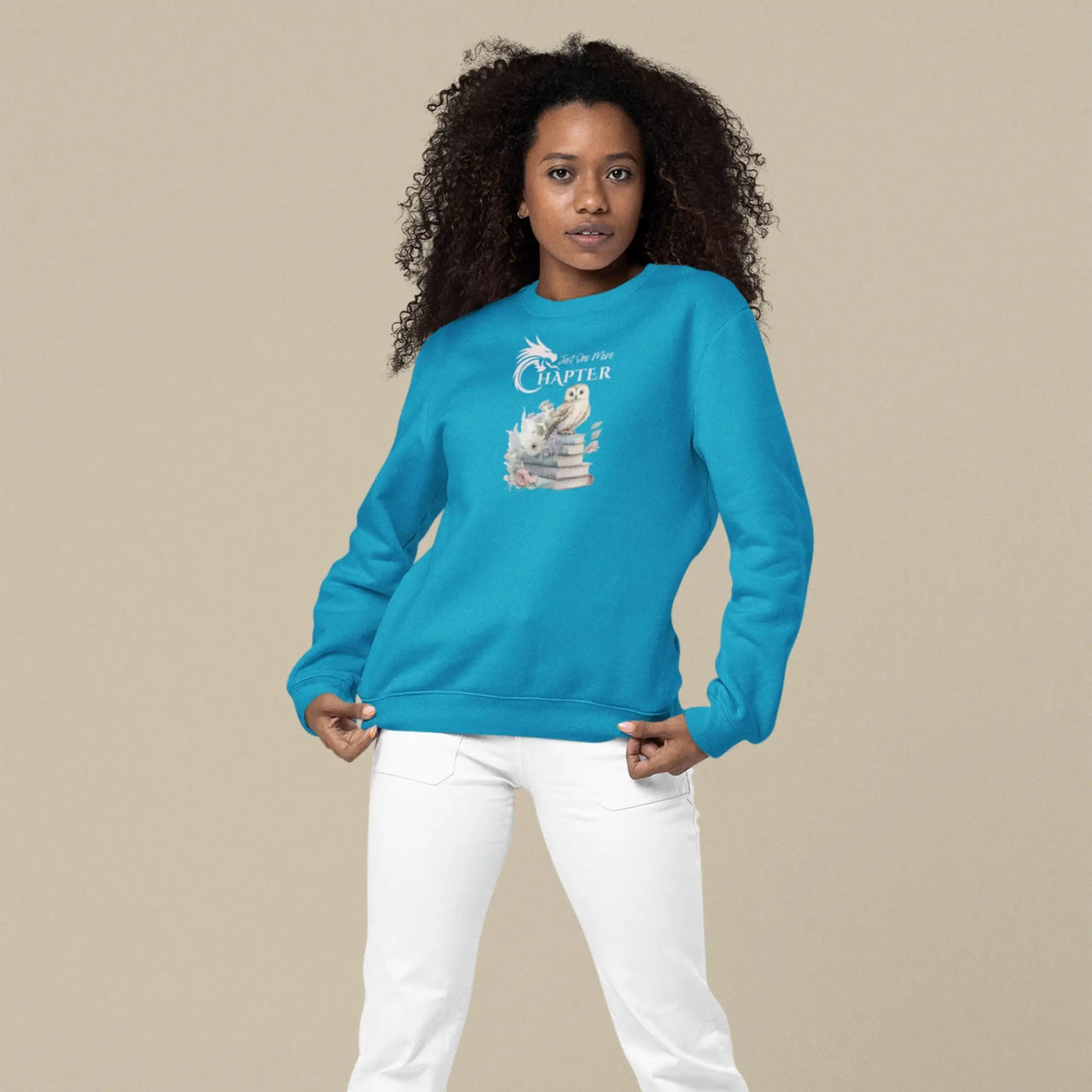 woman wearing a teal Just one more chapter sweatshirt v3 with pink text