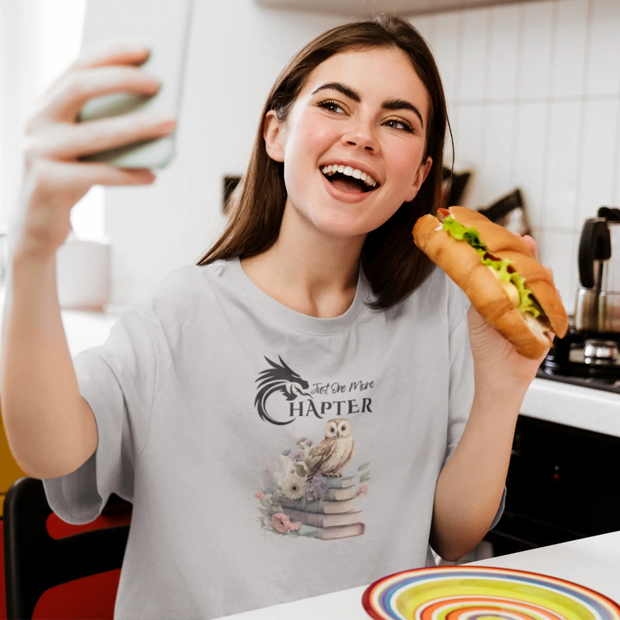 woman eating wearing a Light grey Just One More Chapter T-shirt V3 with black text