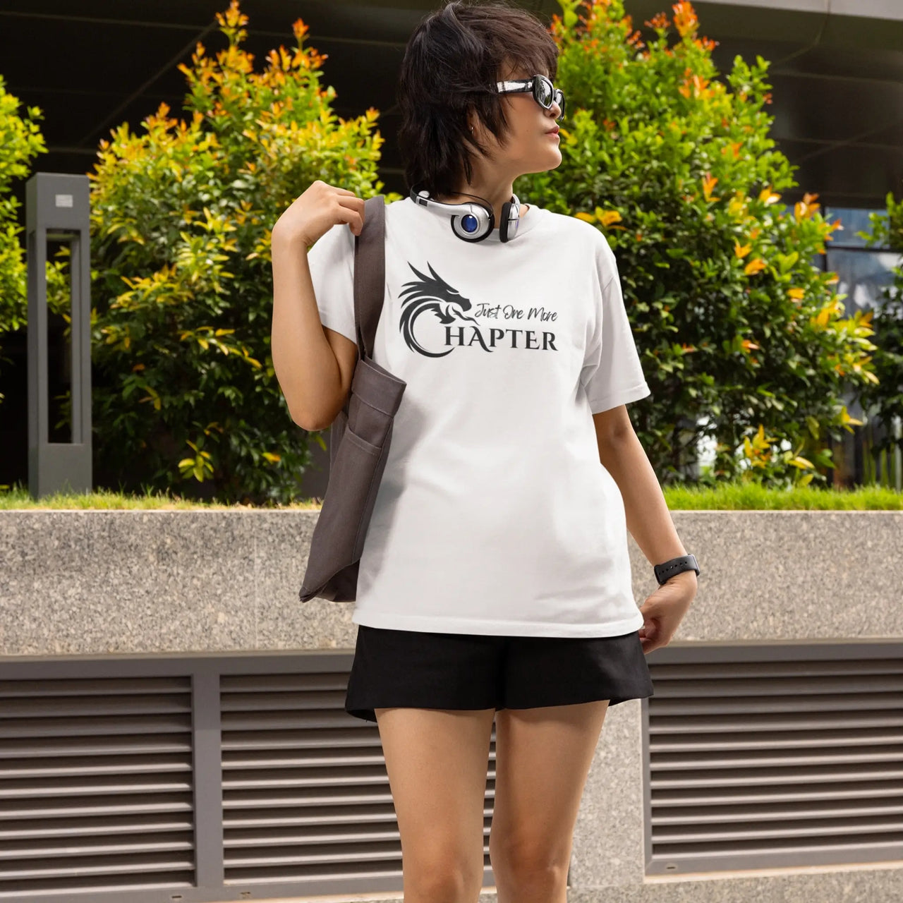 woman wearing a white Just one more chapter tshirt