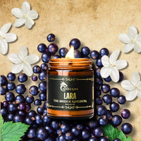 Thumbnail for Lit Lara candle on currants and jasmine