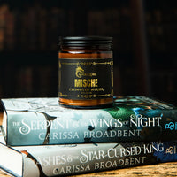 Thumbnail for Mische candle sitting on top of books