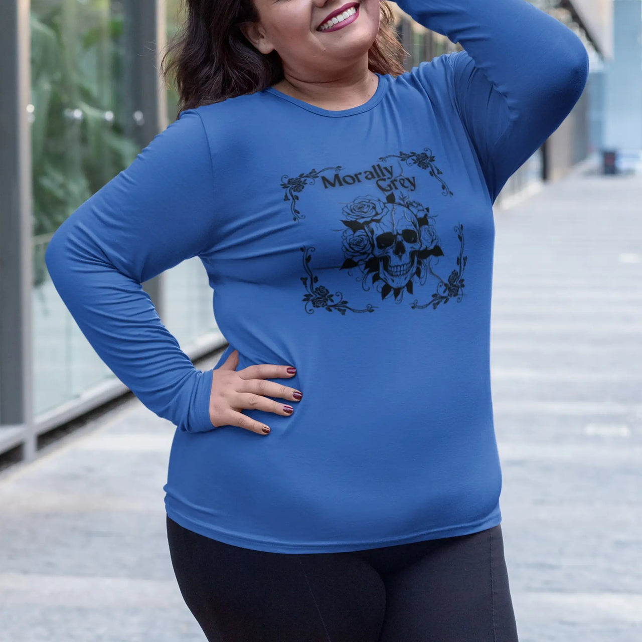 woman wearing a Morally Grey long tshirt on blue design B