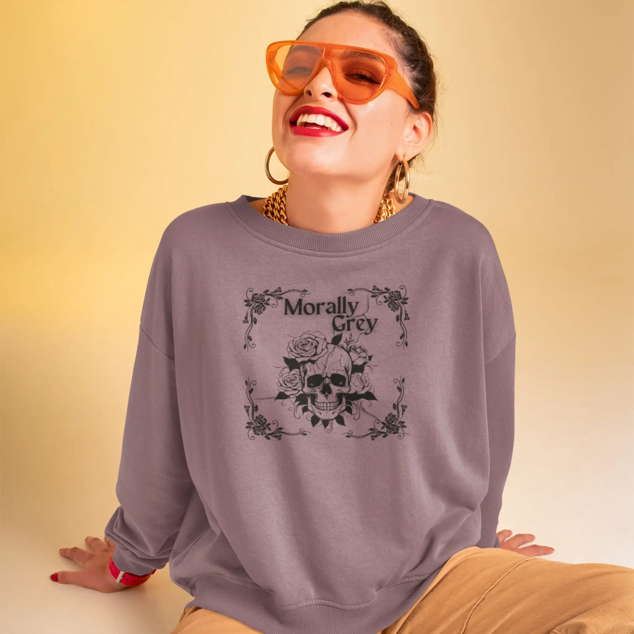 woman wearing a Maroon Morally grey sweatshirt