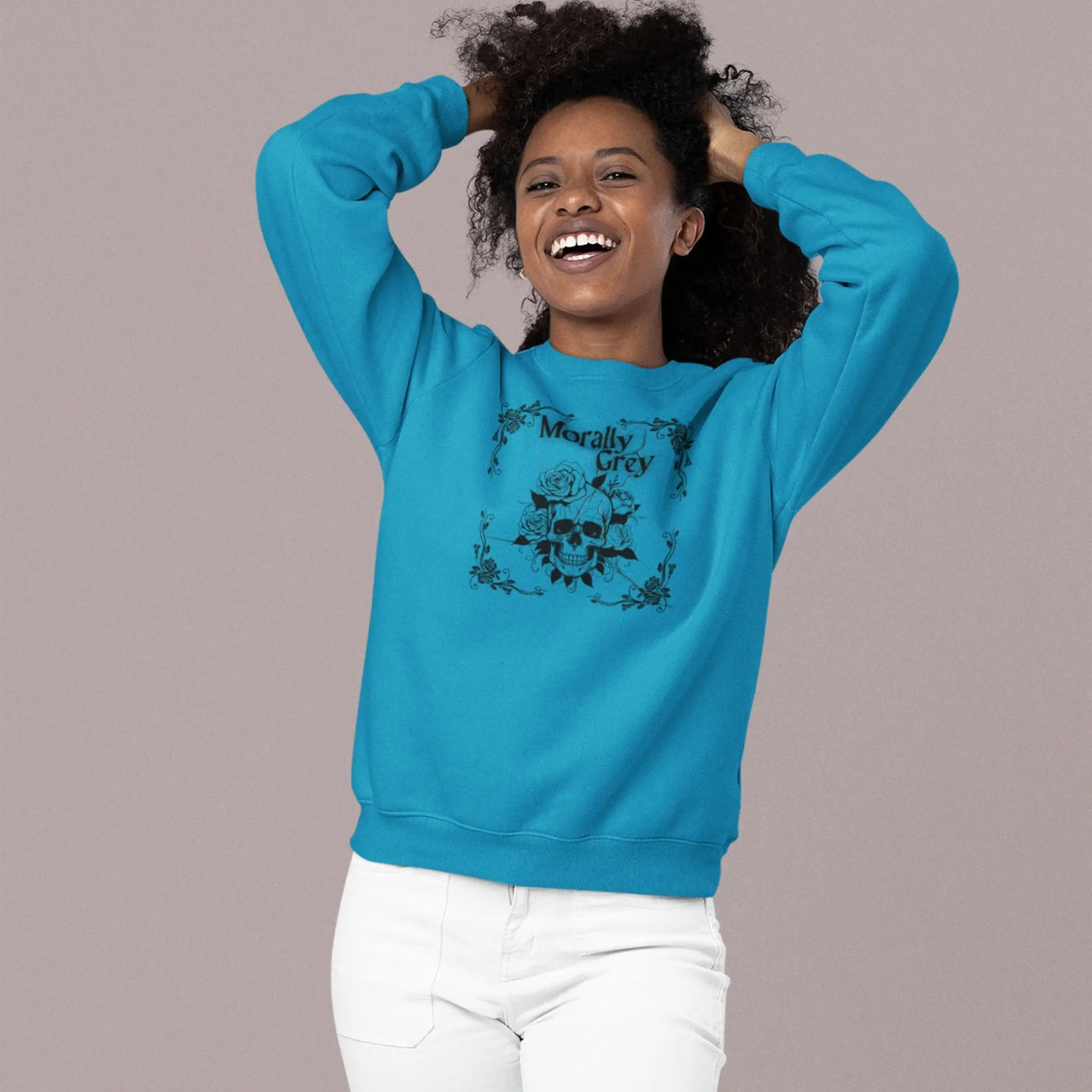 woman wearing a teal Morally grey sweatshirt