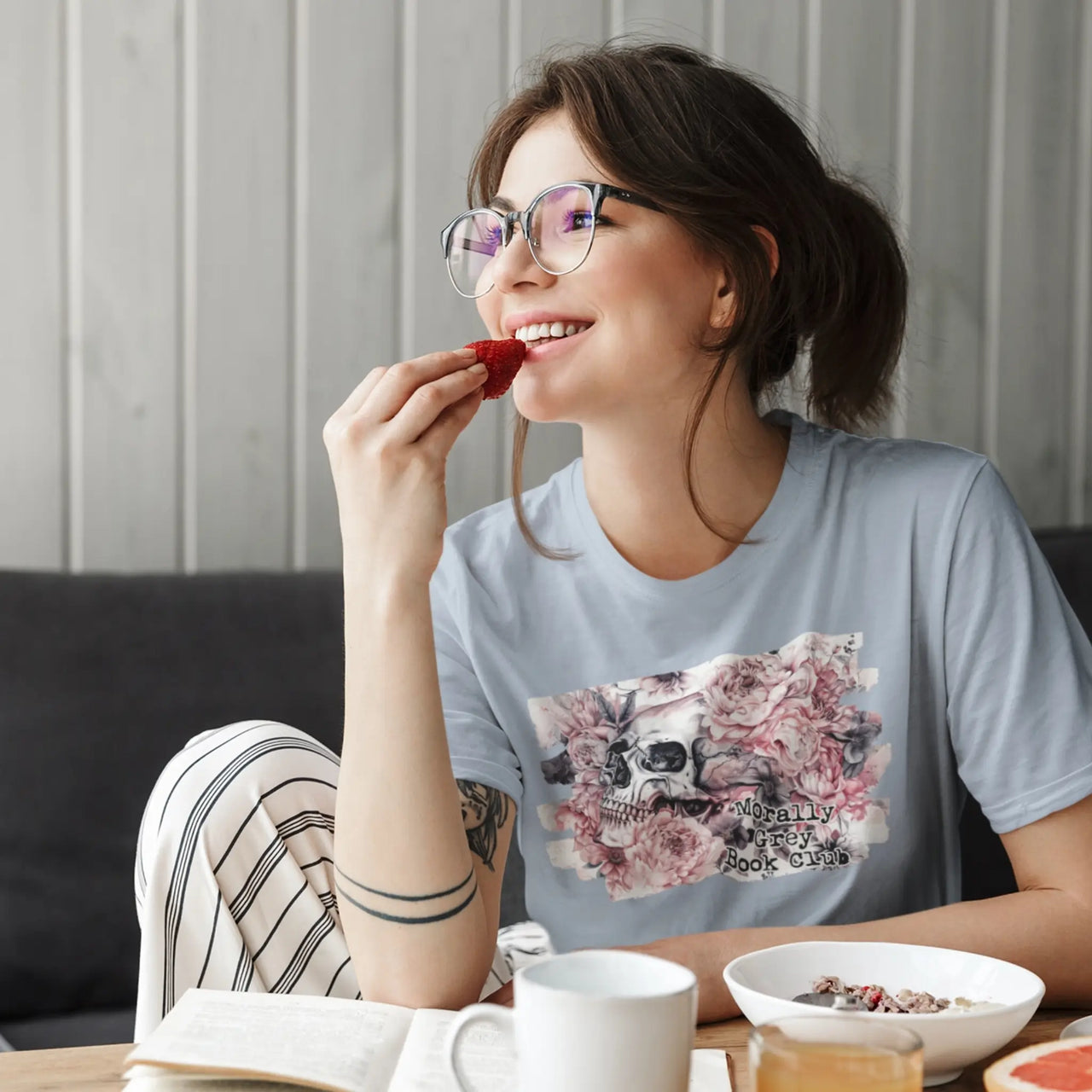 eating and reading wearing a light blue morally grey tshirt v2