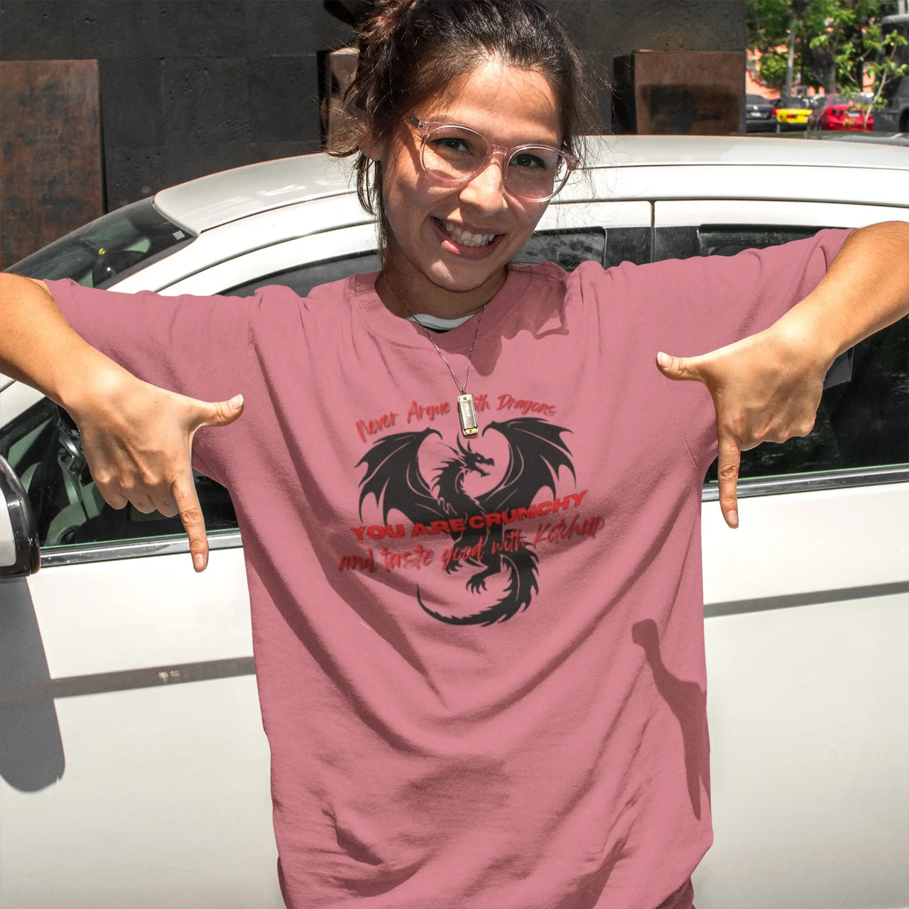 a young woman wearing a Light pink Never Argue With Dragons Tshirt