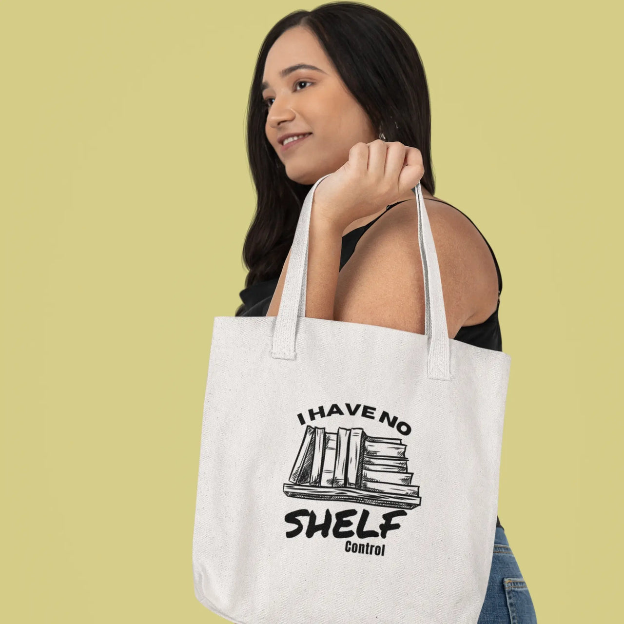 young woman carrying a I have no shelf control tote