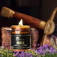 Thumbnail for Oraya candle with flowers, leather, and a sword