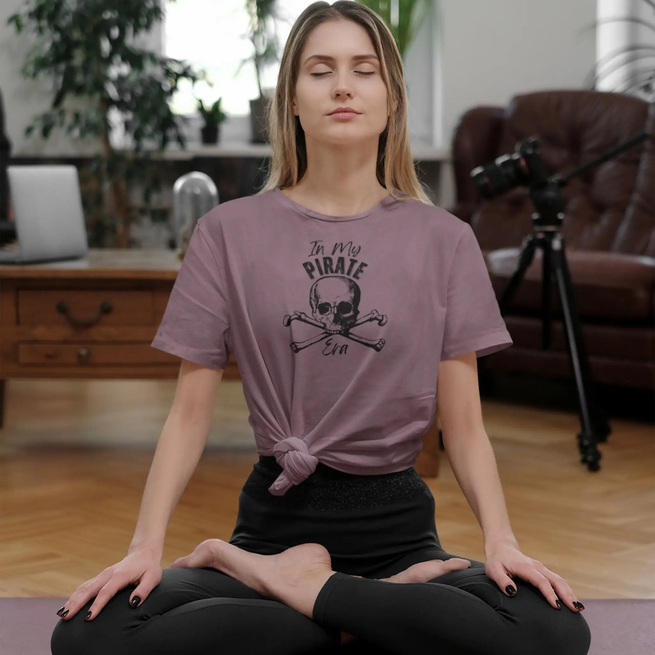 woman doing yoga in a maroon in my pirate era tee 