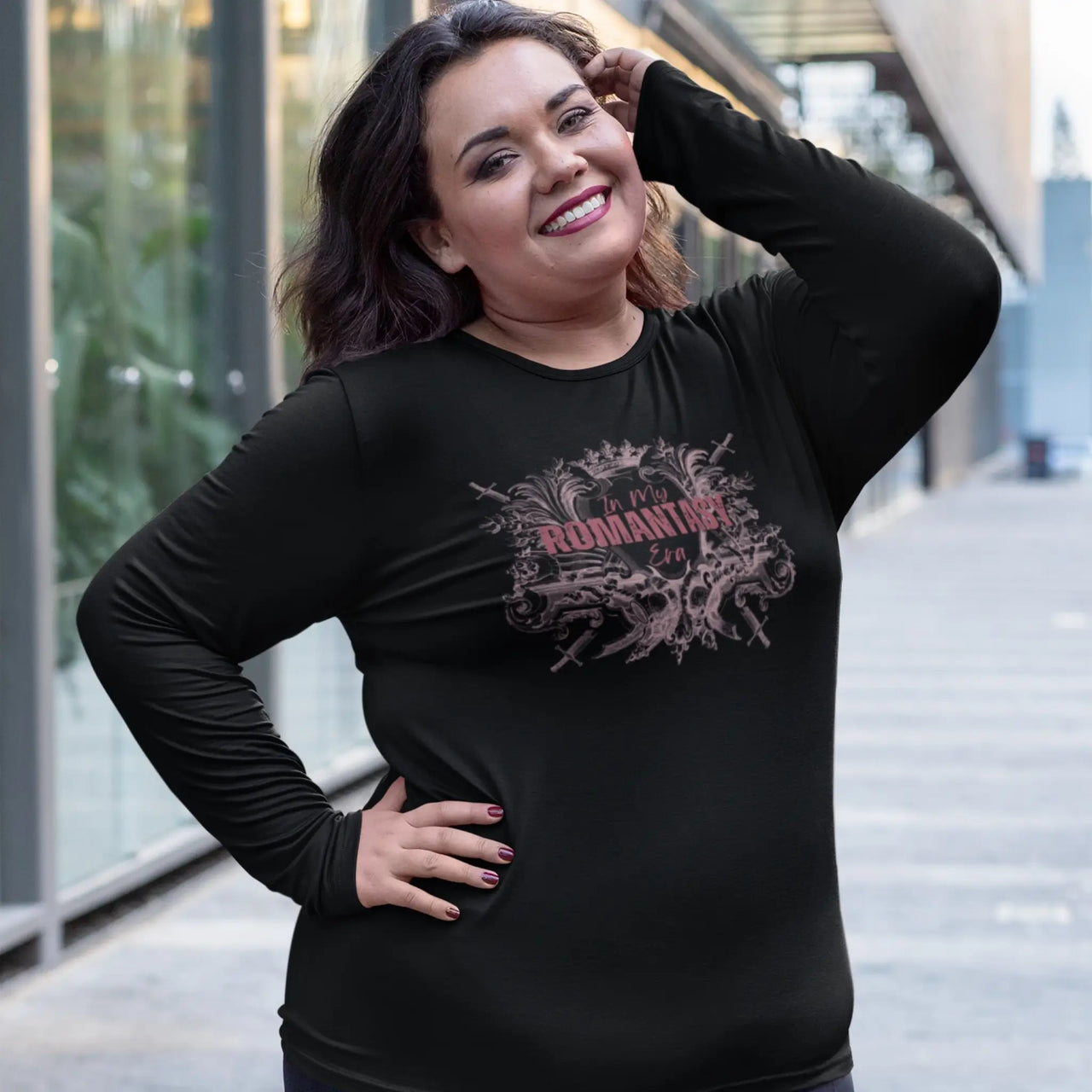 happy woman wearing an In My Romantasy Era shirt on black with pink text