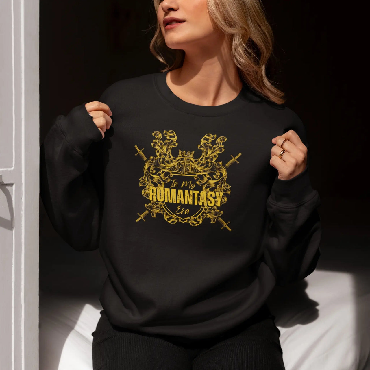 woman wearing a Black In my romantasy era sweatshirt yellow design