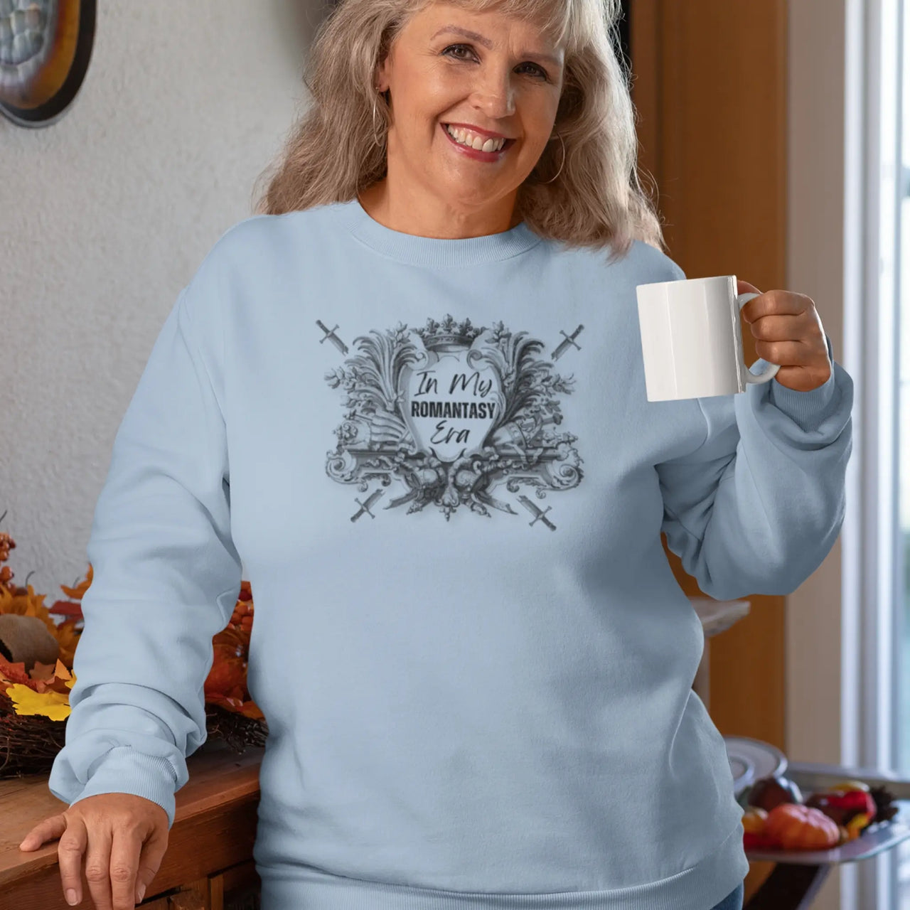 woman drinking coffee wearing the blue In My Romantasy Era V2 red design