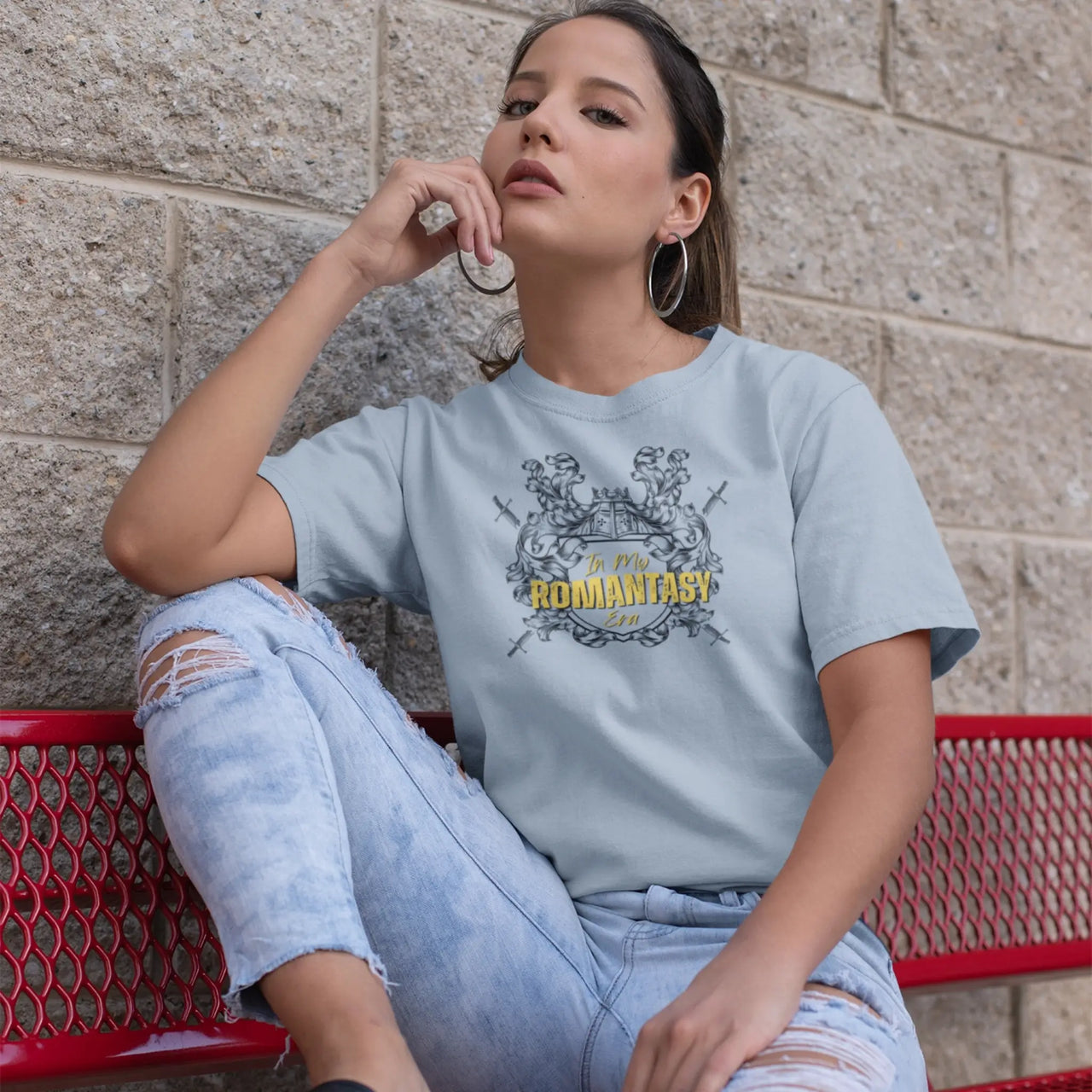 woman posing with the light blue In My Romantasy Era Tshirt V4 with yellow text