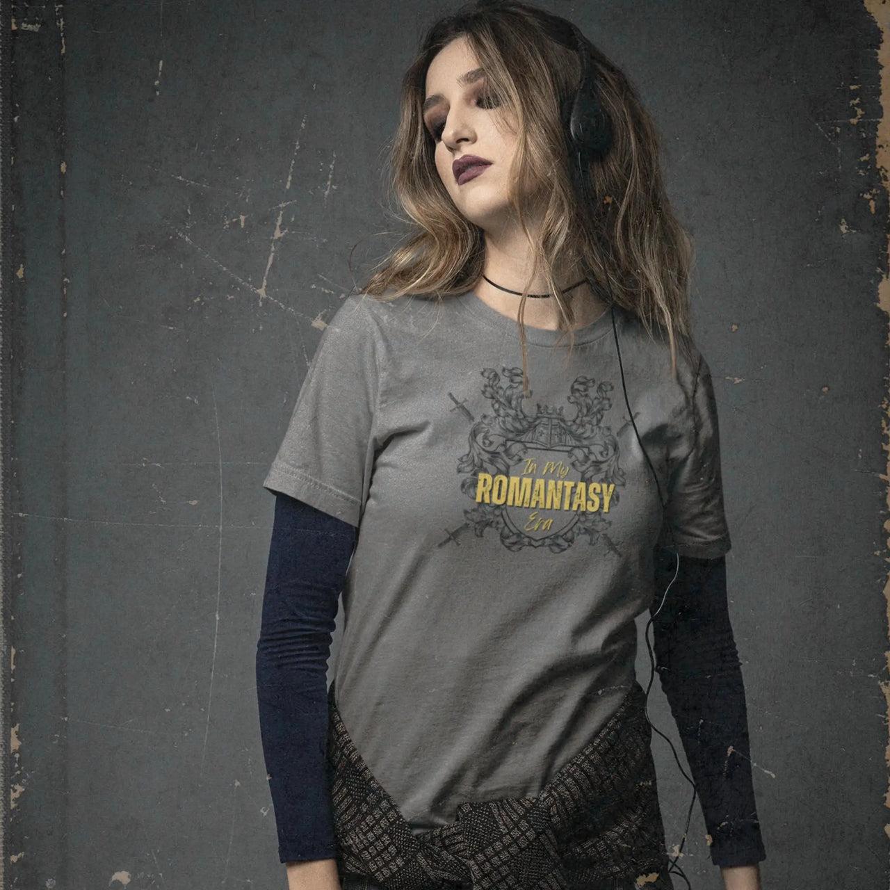 young woman wearing a dark grey In My Romantasy Era Tshirt V4 with yellow text