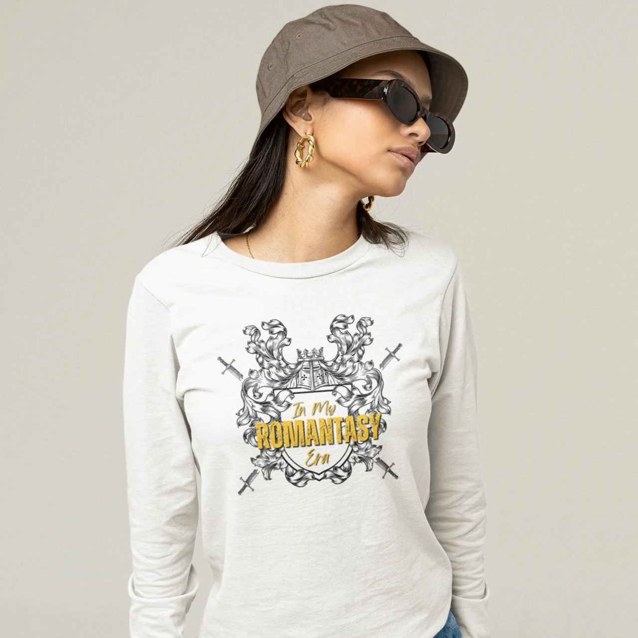 woman wearing a In My Romantasy Era shirt on white with gold text