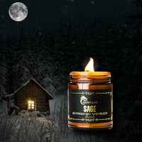 Thumbnail for Lit Sage themed candle in the woods with a cabin