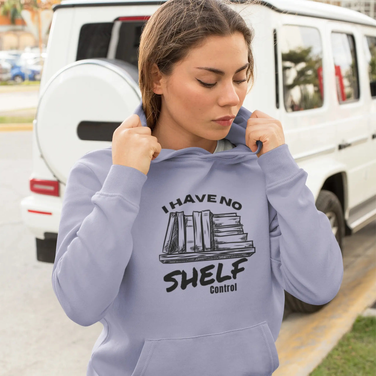 woman wearing a I have no shelf control hoodie in violet