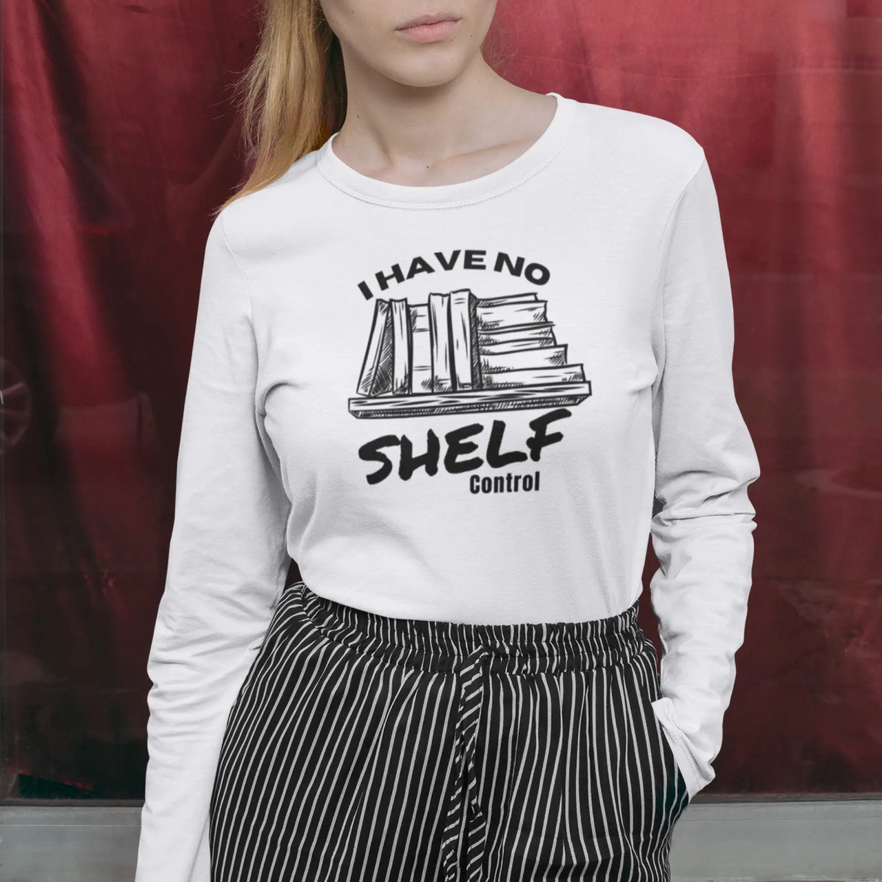 a woman wearing a I have no shelf control long sleeve tee on white