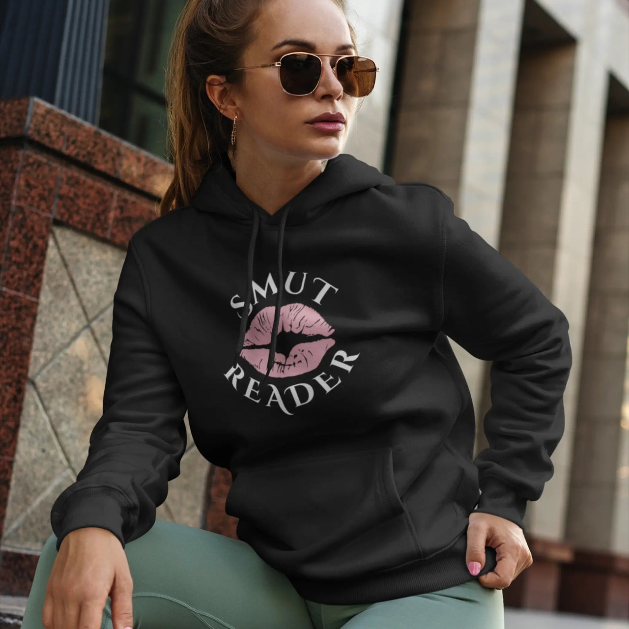 model wearing a black smut reader hoodie