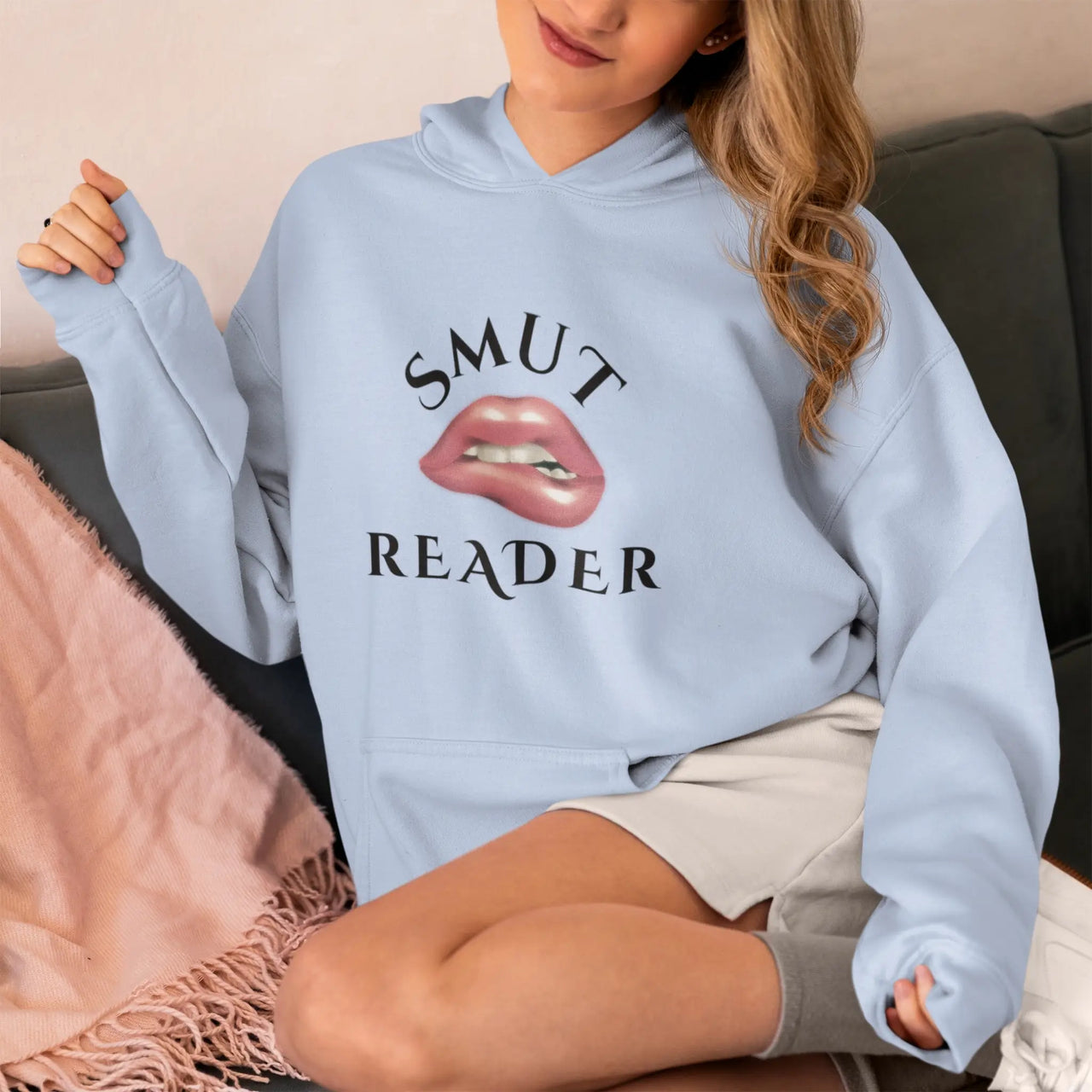 young woman wearing a blue Smut Reader Hoodie V2