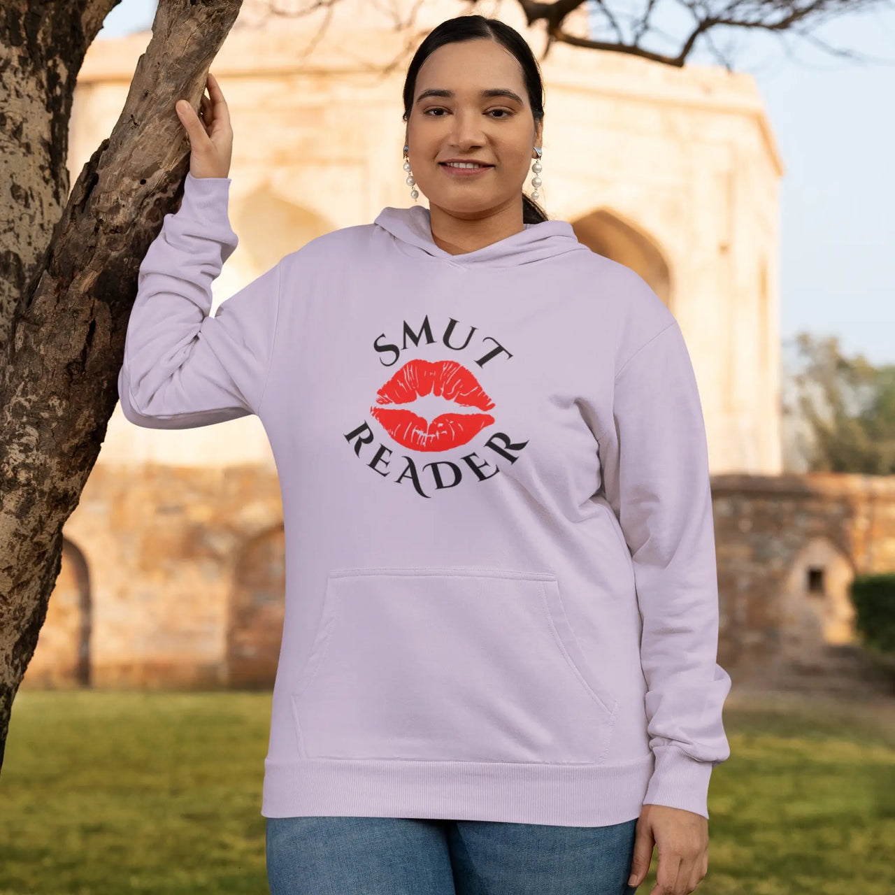 woman posing in a an orchid smut reader hoodie