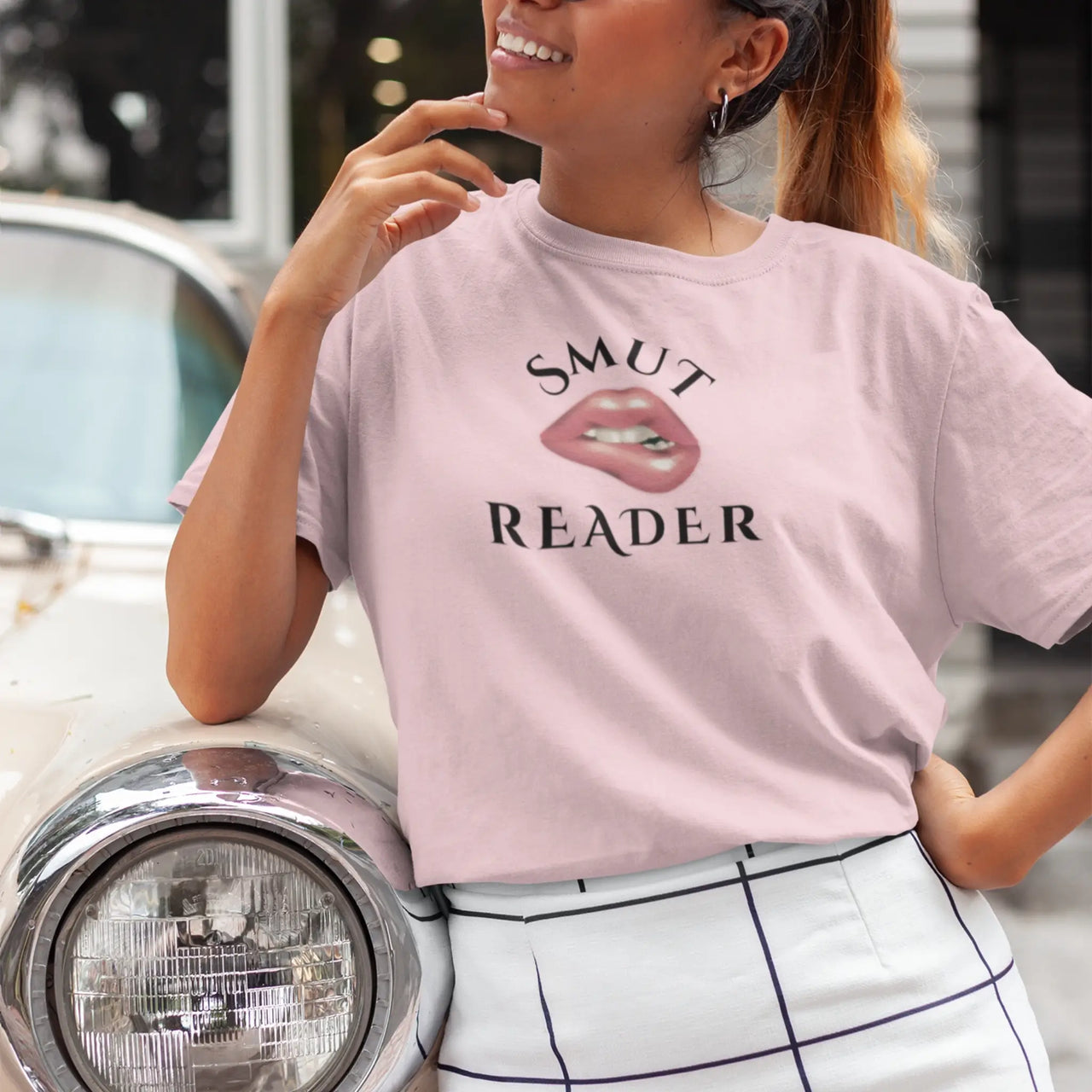 woman wearing a light pink smut reader v3 tshirt 