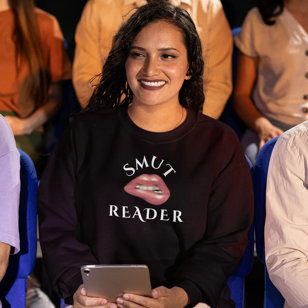 smiling woman wearing our black smut reader sweatshirt v2