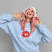 Thumbnail for woman wearing a light blue smut reader sweatshirt with white text