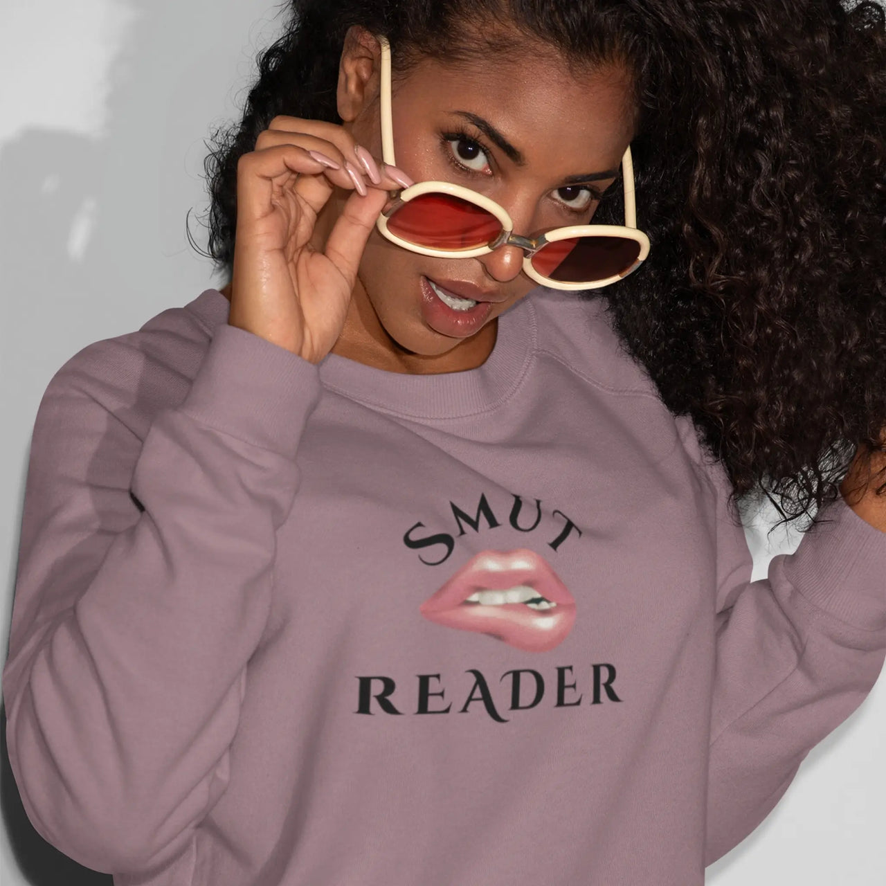 woman wearing the maroon smut reader sweatshirt v2