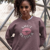 Thumbnail for woman wearing a heather maroon smut reader sweatshirt pink lips