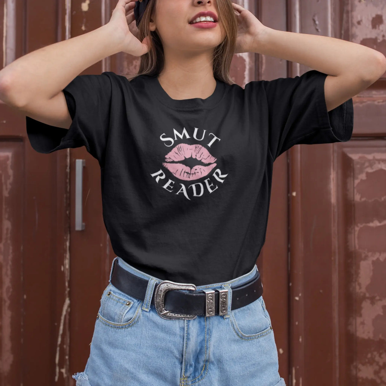 woman wearing the black smut reader t-shirt pink lips