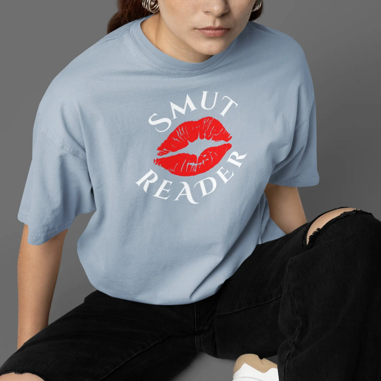 woman wearing a light blue smut reader v1 tshirt 