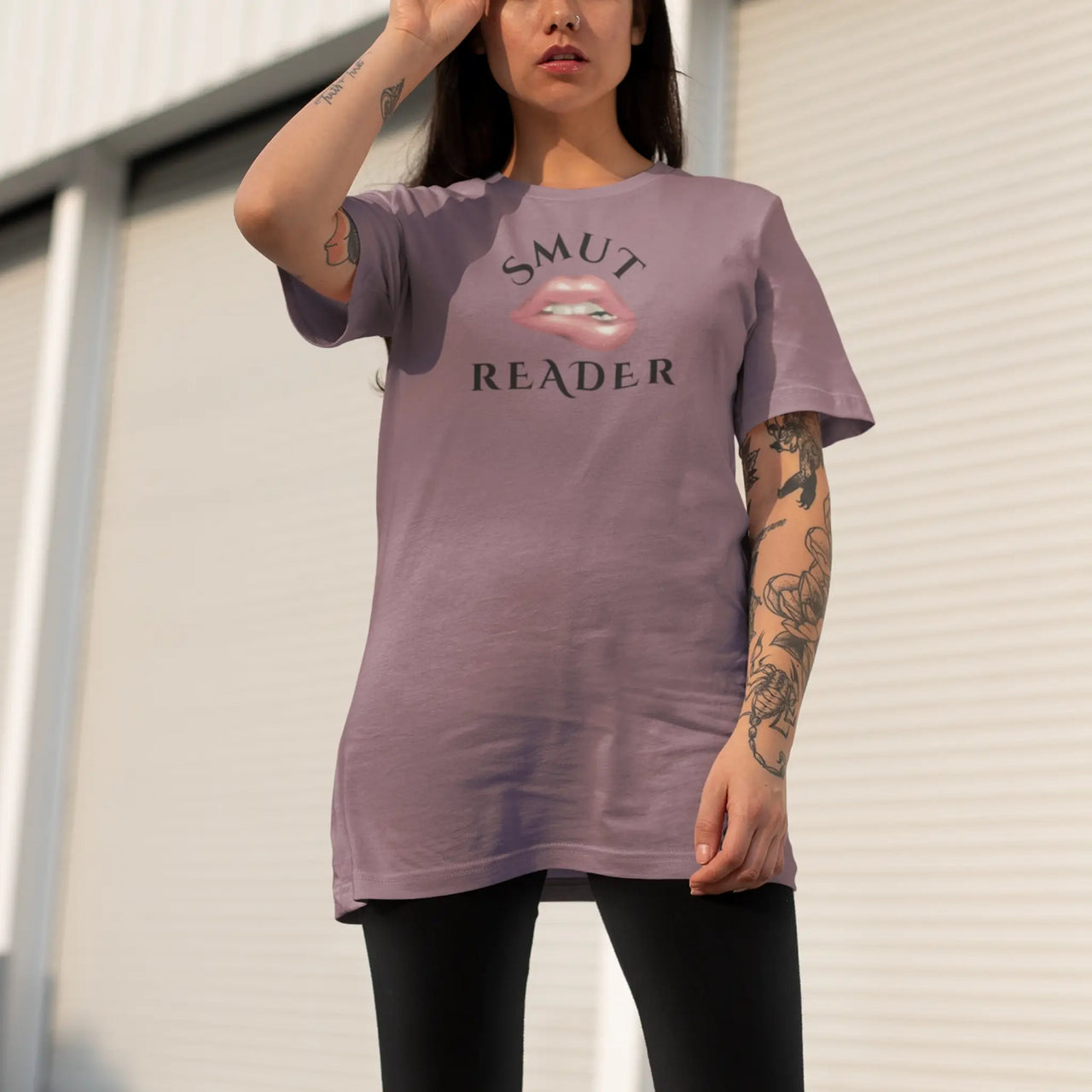 woman wearing an oversized heather maroon smut reader v3 tshirt