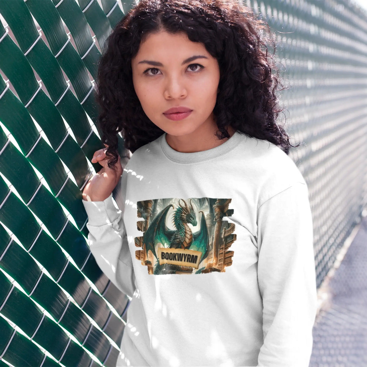 young woman wearing a white bookwyrm long sleeve t